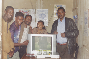 Deaf in ENAD Adama branch receiving a TV set bought through the HAPCO project from the ENAD chairman in 2005